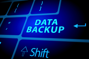 A small business office with a remote setup, showing servers, computers, and backup systems in place for disaster recovery