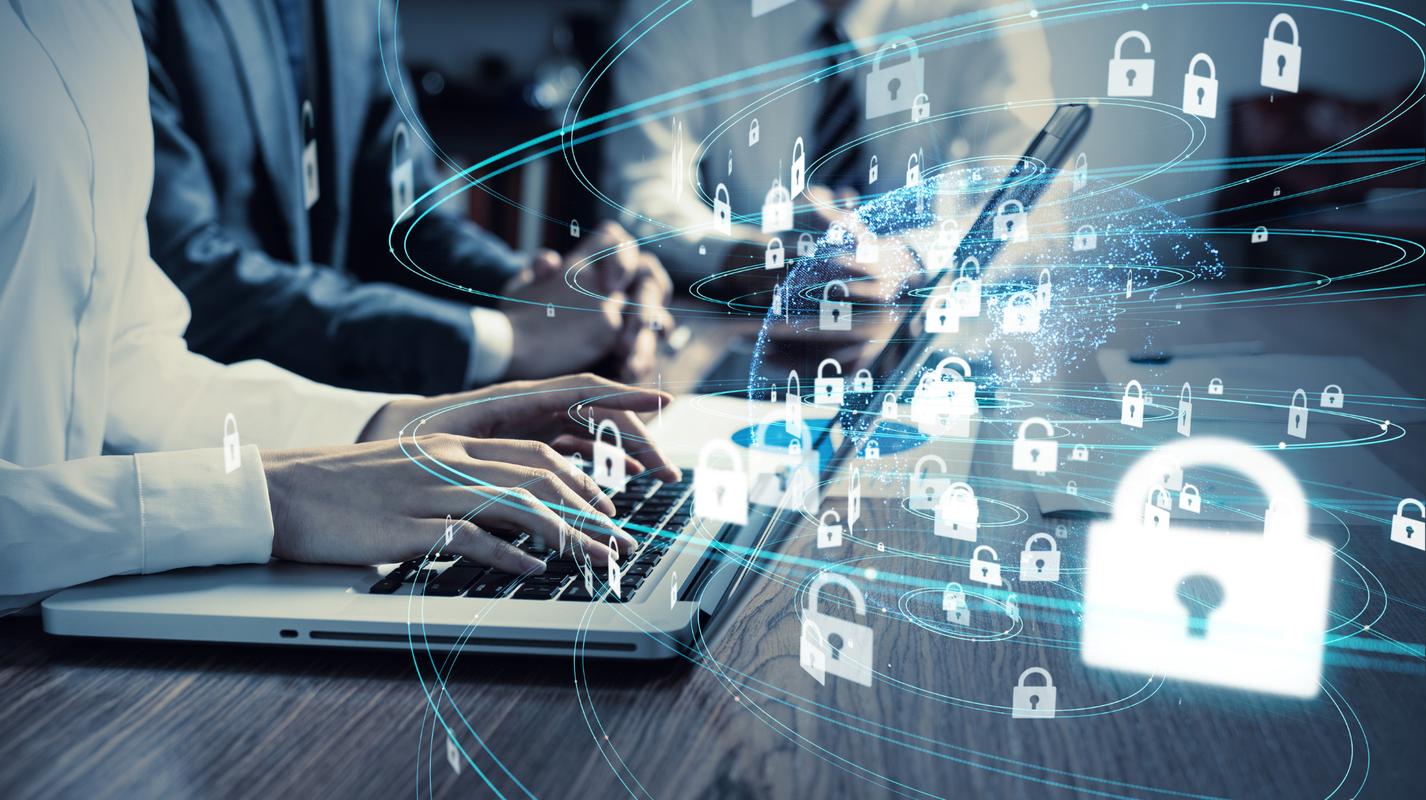 A small business office with a locked door, security cameras, and employees using encrypted devices to work remotely