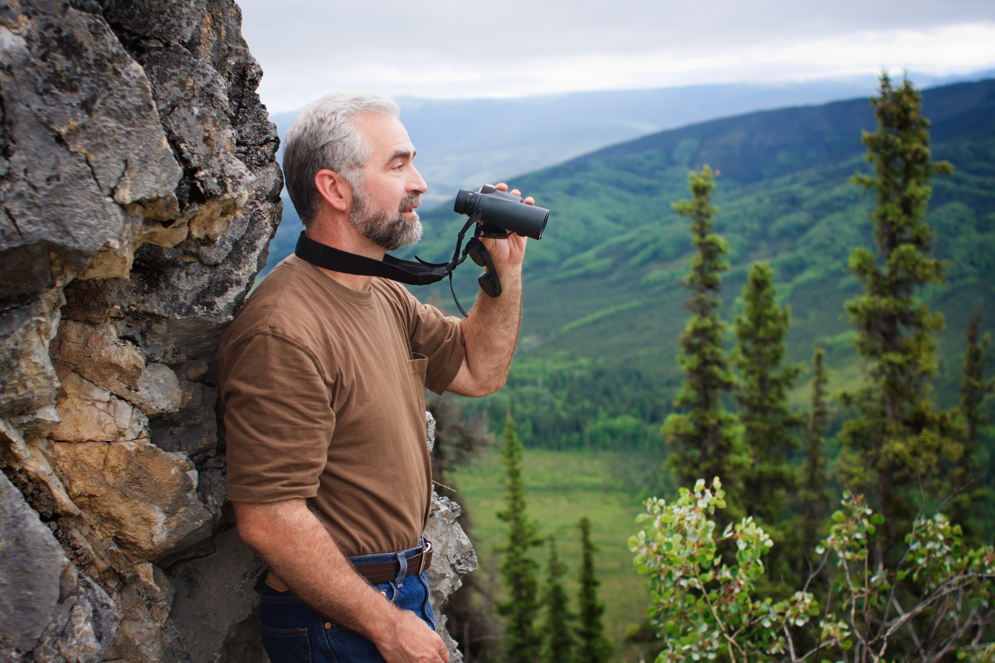 A small, remote business owner navigating through rugged terrain with limited resources