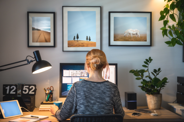 A small business owner working from home using remote workforce technology