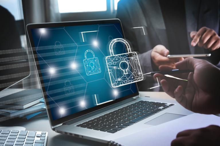 A small business owner working on a laptop with a secure lock icon, surrounded by virtual security shields