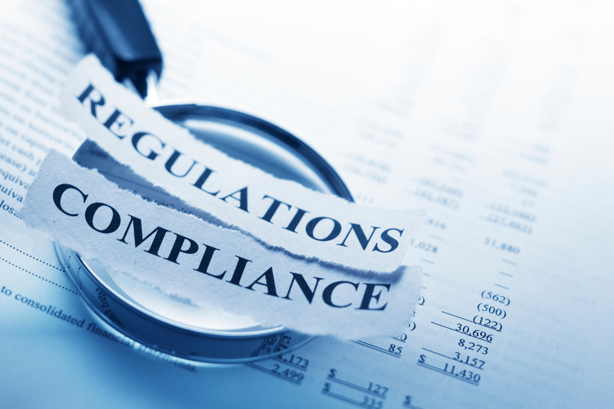 A small business office with secure IT systems and compliance measures in place, with remote access capabilities