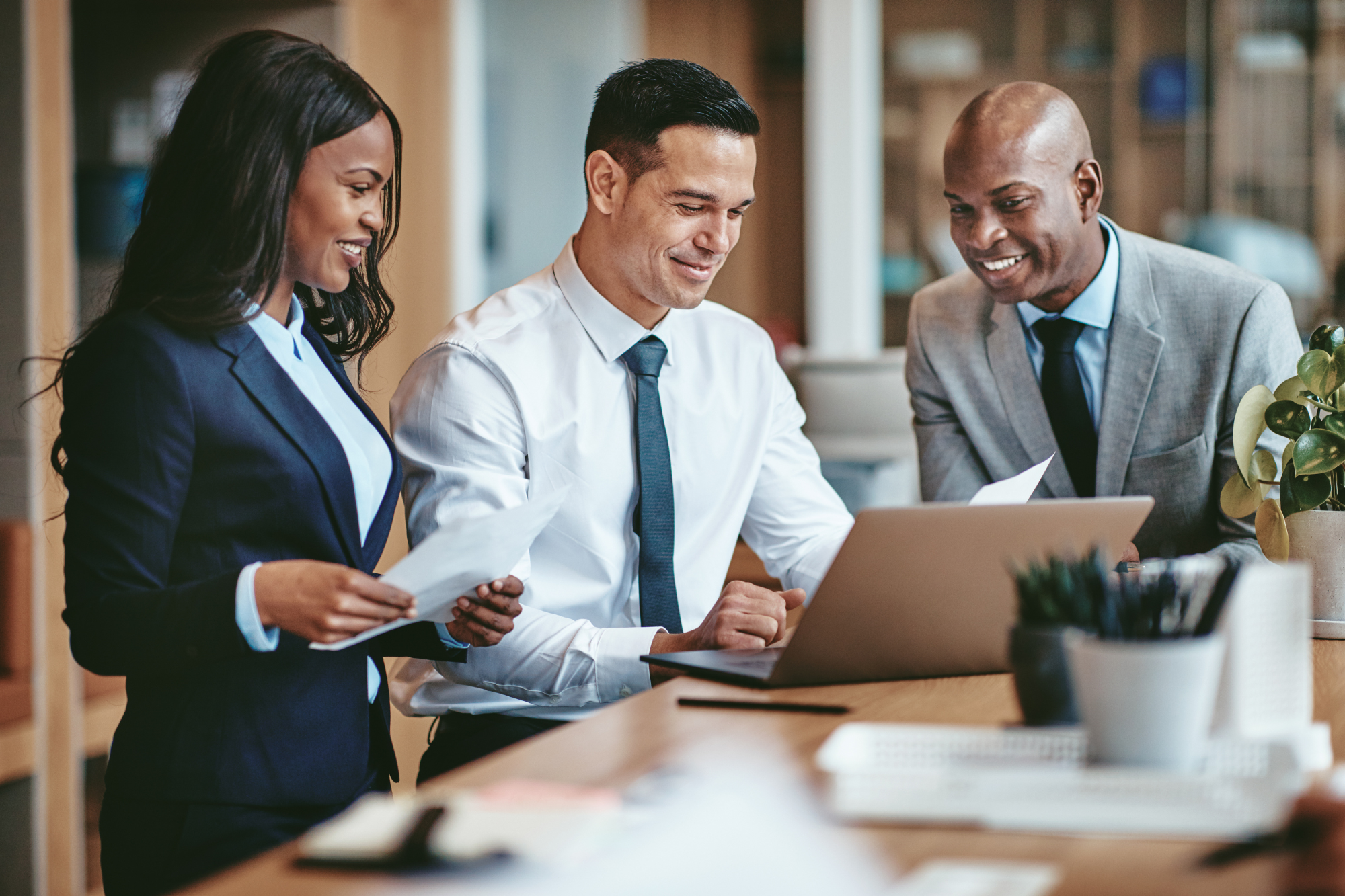 A group of diverse business professionals working together on a virtual platform, sharing ideas and documents in real-time